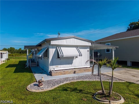 Photo of 115 Conestoga Trail, North Fort Myers, FL 33917 (MLS # 2026039131)