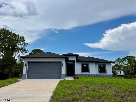 Photo of 426 Mallory Avenue S, Lehigh Acres, FL 33974 (MLS # 2026035703)