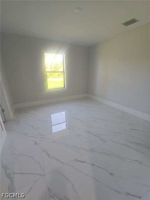 Tiny photo for 457 Woodman Drive, Lehigh Acres, FL 33972 (MLS # 2026020031)