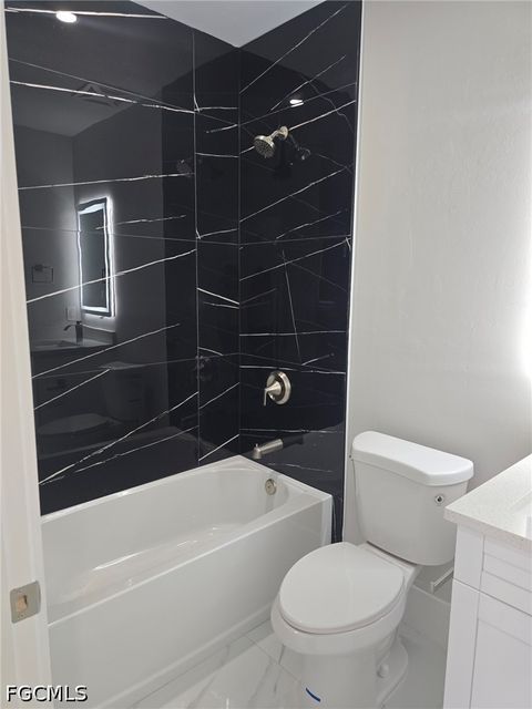 Tiny photo for 457 Woodman Drive, Lehigh Acres, FL 33972 (MLS # 2026020031)