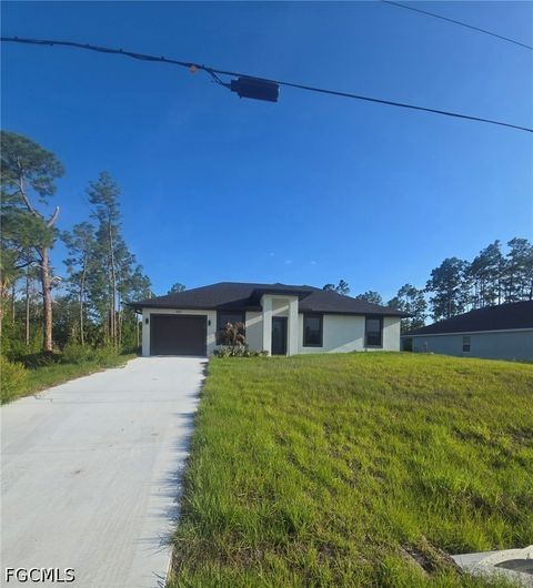 Photo of 457 Woodman Drive, Lehigh Acres, FL 33972 (MLS # 2026020031)