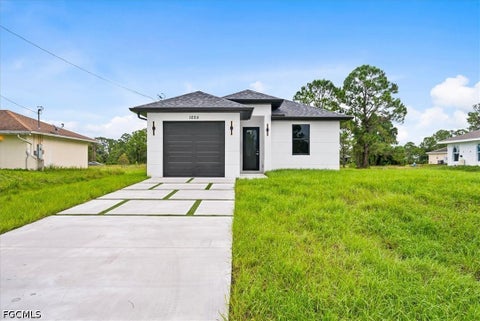 Photo of 1025 Marshall Avenue S, Lehigh Acres, FL 33974 (MLS # 2026041079)
