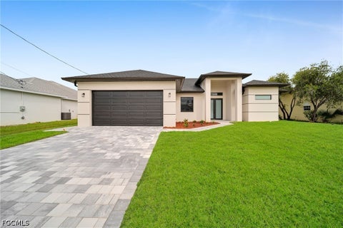 Photo of 743 Chestnut Street E, Lehigh Acres, FL 33974 (MLS # 2026038310)