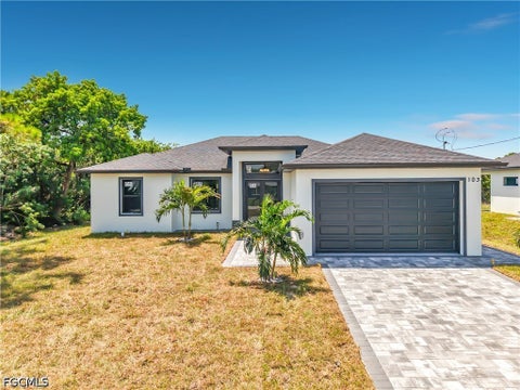 Photo of 103 Ruby Avenue N, Lehigh Acres, FL 33971 (MLS # 2026035167)