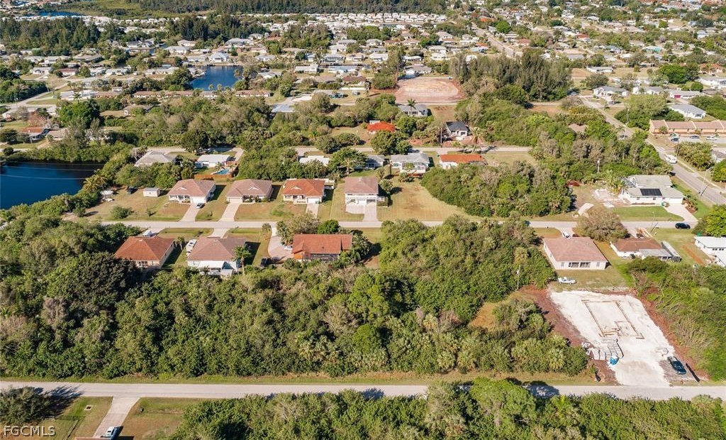 Aerial perspective of suburban area with a nearby
