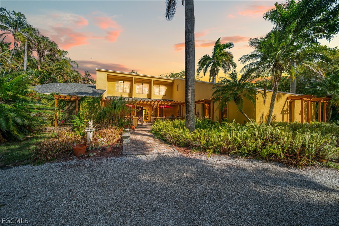 View of front of house featuring stucco siding and