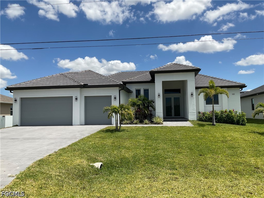 The property features a well-maintained lawn, a co