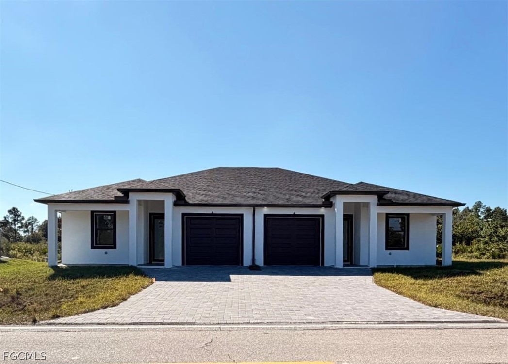 Prairie-style house featuring a front lawn, decora