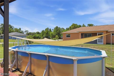 Tiny photo for 404 Parkdale Boulevard, Lehigh Acres, FL 33974 (MLS # 2026030808)