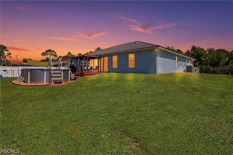Tiny photo for 404 Parkdale Boulevard, Lehigh Acres, FL 33974 (MLS # 2026030808)