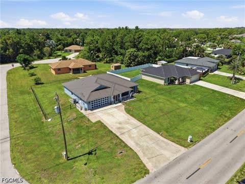 Tiny photo for 404 Parkdale Boulevard, Lehigh Acres, FL 33974 (MLS # 2026030808)