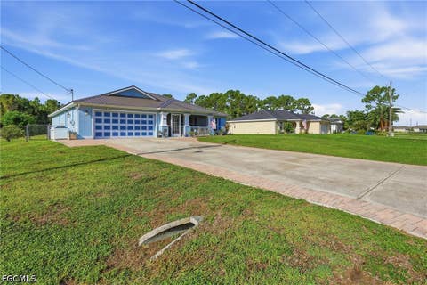 Tiny photo for 404 Parkdale Boulevard, Lehigh Acres, FL 33974 (MLS # 2026030808)