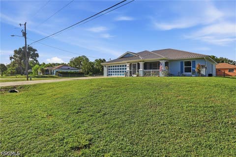 Tiny photo for 404 Parkdale Boulevard, Lehigh Acres, FL 33974 (MLS # 2026030808)