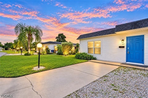 Photo of 37 Hamlin Court, Lehigh Acres, FL 33936 (MLS # 2026038600)