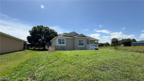 Photo of 824 Frederick Reid Street E, Lehigh Acres, FL 33974 (MLS # 2026038905)