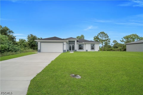 Photo of 859 Chicago Street, Lehigh Acres, FL 33974 (MLS # 2026040682)