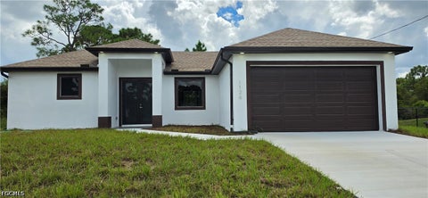Photo of 1126 Milwaukee Boulevard, Lehigh Acres, FL 33974 (MLS # 2026039474)