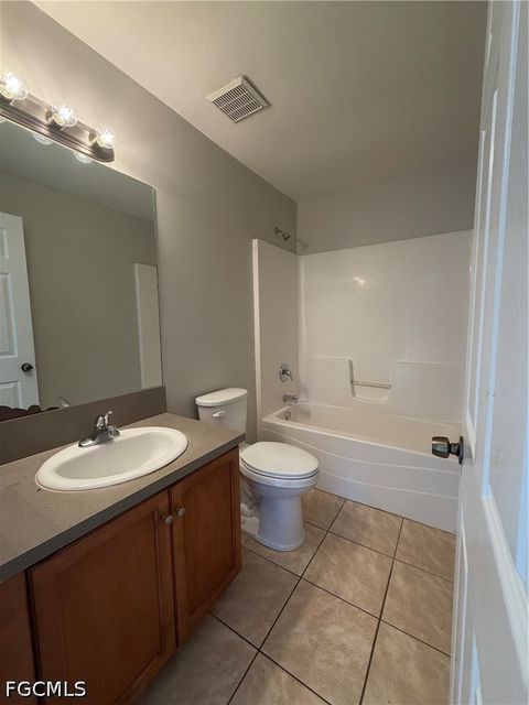 Tiny photo for 704 Gilbert Avenue S, Lehigh Acres, FL 33973 (MLS # 2026018952)