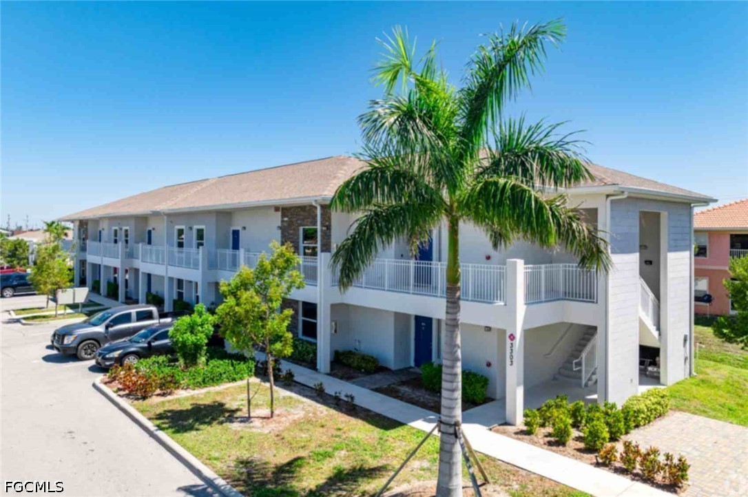 View of front of home featuring uncovered parking