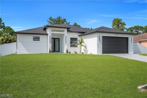Photo of 766 Longbow Lane, Lehigh Acres, FL 33972 (MLS # 2026035695)