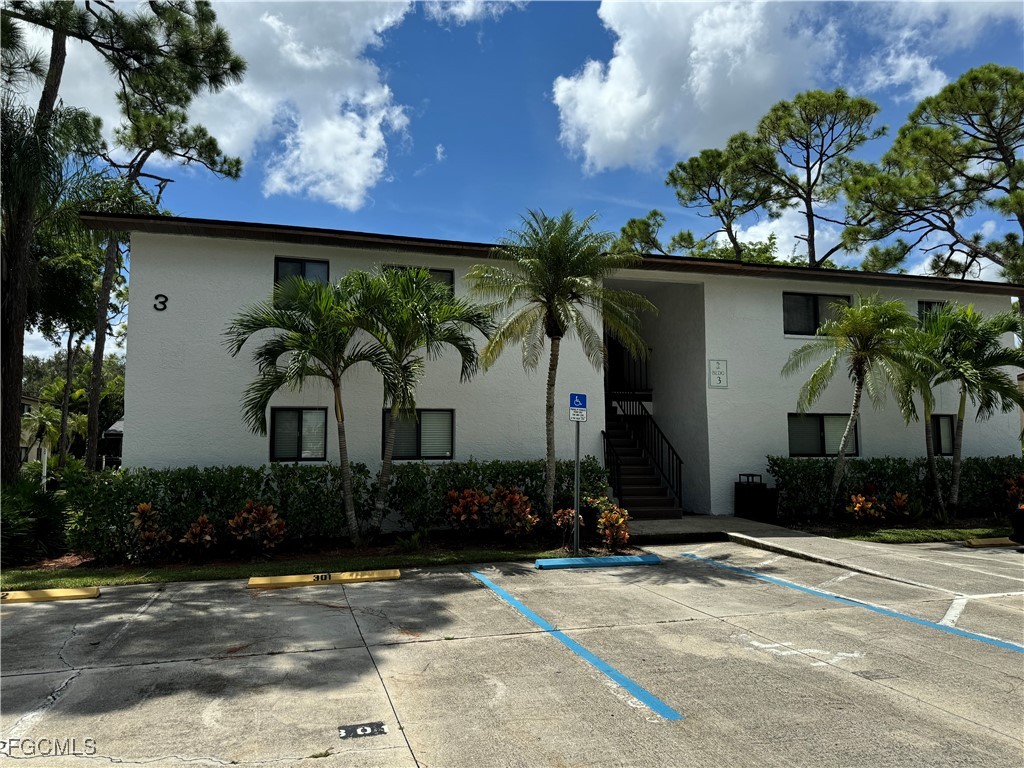 View of building exterior featuring uncovered park