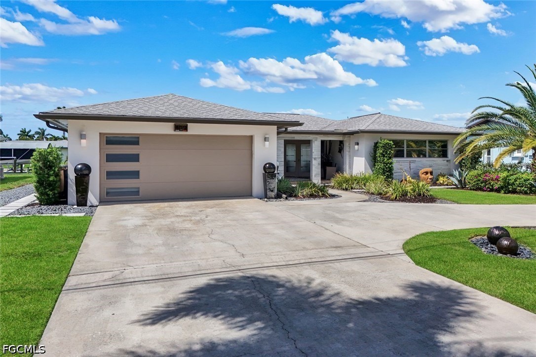 Photo 1 of 48 — 409 Tower Drive, Cape Coral, FL 33904