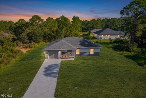 Photo of 1011 Kent Street E, Lehigh Acres, FL 33974 (MLS # 2026039154)