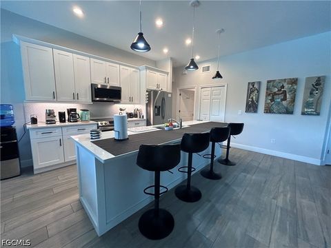 Tiny photo for 1008 NW 12th Avenue, Cape Coral, FL 33993 (MLS # 2026020085)