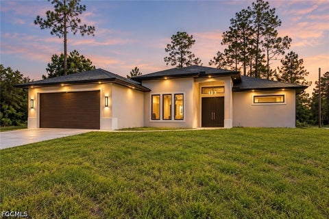 Photo of 3207 E 10th Street, Lehigh Acres, FL 33972 (MLS # 2026040383)