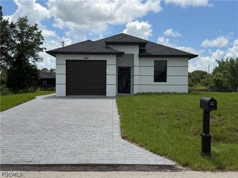 Photo of 868 Carbon Street E, Lehigh Acres, FL 33974 (MLS # 2026041617)