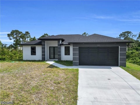 Photo of 3313 66th Street W, Lehigh Acres, FL 33971 (MLS # 2026041338)
