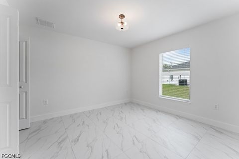 Tiny photo for 1042 Cheney Avenue S, Lehigh Acres, FL 33974 (MLS # 2026015285)