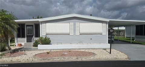 Photo of 547 Palmer Boulevard, North Fort Myers, FL 33903 (MLS # 2026031093)