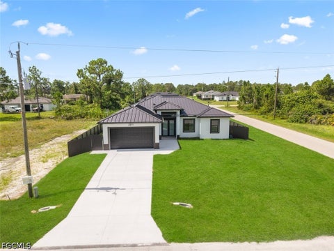 Photo of 2911 38th Street W, Lehigh Acres, FL 33971 (MLS # 2026030882)