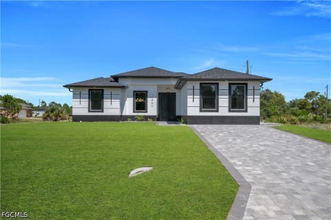 Photo of 1907 W 14th Street, Lehigh Acres, FL 33972 (MLS # 2026035305)