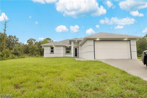 Photo of 607 W 6th Street, Lehigh Acres, FL 33972 (MLS # 2026042759)