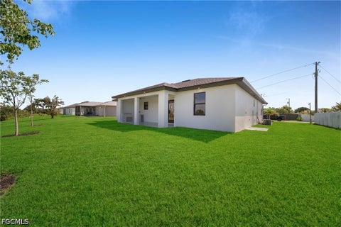 Tiny photo for 908 NE 11th Avenue, Cape Coral, FL 33909 (MLS # 2026036661)
