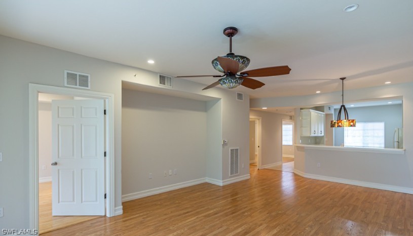 Unfurnished living room with baseboards, recessed