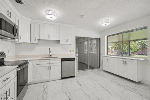 Photo of 638 NE 15th Court, Cape Coral, FL 33909 (MLS # 2026034885)