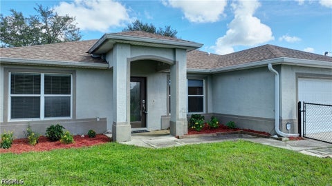 Photo of 3020 62nd Street W, Lehigh Acres, FL 33971 (MLS # 2026039413)