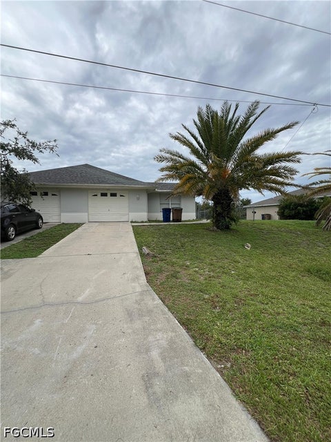 Photo of 1543 Hightower Avenue S, Lehigh Acres, FL 33973 (MLS # 2026030814)