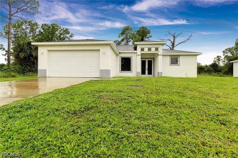 Photo of 210 Genoa Avenue S, Lehigh Acres, FL 33974 (MLS # 2026041093)