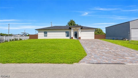 Photo of 747 Fleming Avenue S, Lehigh Acres, FL 33974 (MLS # 2026037285)
