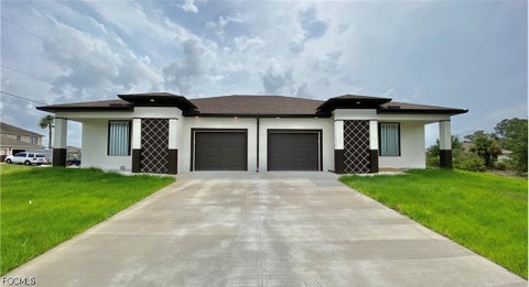 Photo of 2403 Dickens Avenue N, Lehigh Acres, FL 33971 (MLS # 2026039394)