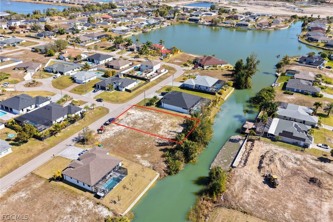 Aerial view of residential area with a nearby body