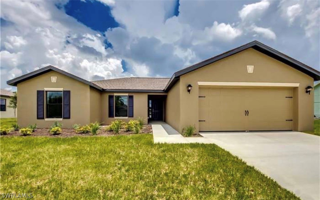 Single story home with stucco siding, an attached
