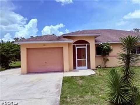 Photo of 1221 E 12th Street, Lehigh Acres, FL 33972 (MLS # 2026009966)