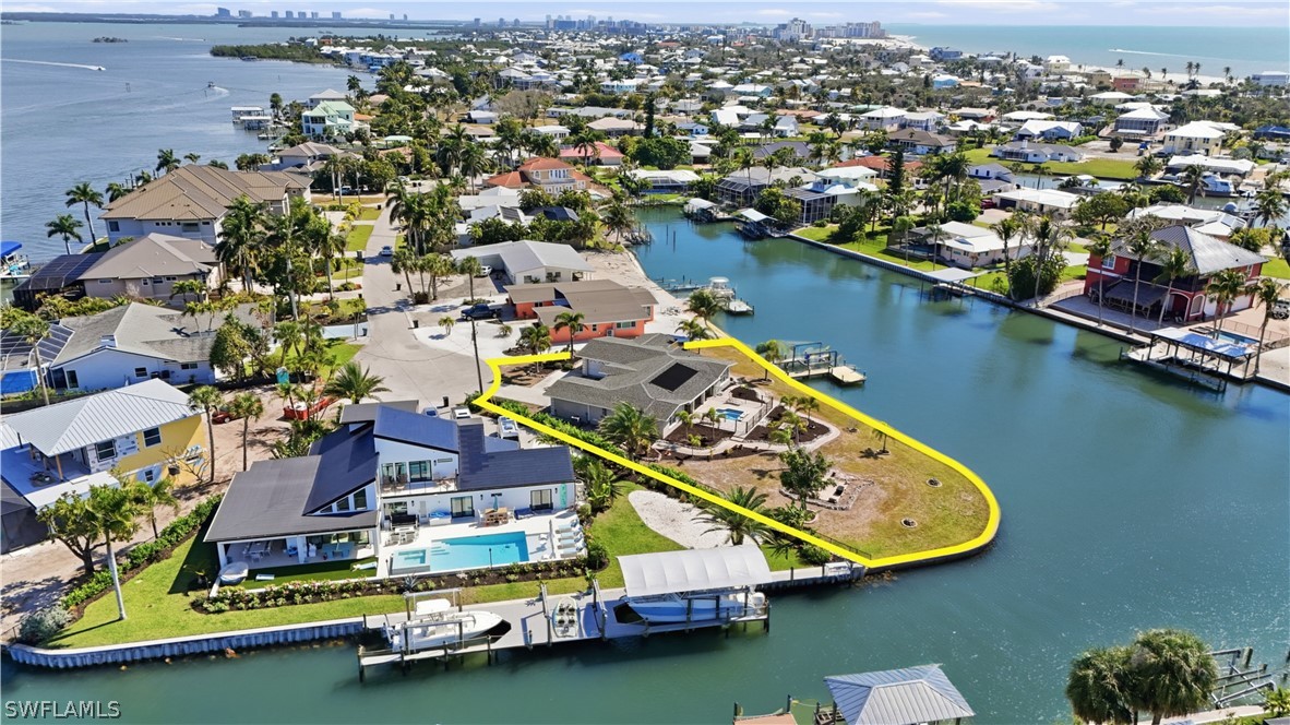 Aerial view of property and surrounding area with