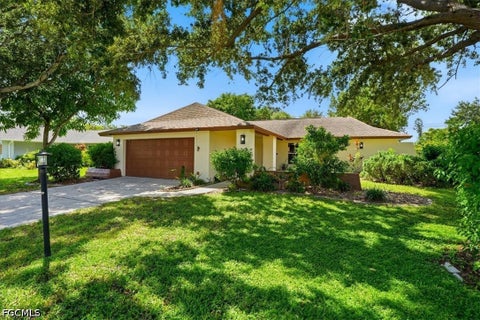 Photo of 1441 SAUTERN Drive, Fort Myers, FL 33919 (MLS # 2026035543)