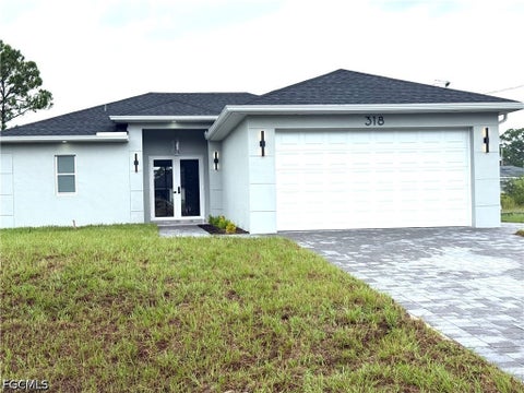Photo of 318 Genoa Avenue S, Lehigh Acres, FL 33974 (MLS # 2026042627)